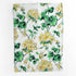 Floral patterned geranium tea towel with green and yellow geranium flowers on a white background