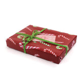 colorful christmas wrapping paper with colored candy cane motifs