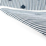 reverse of A blue accent rug with a daisies pattern on it