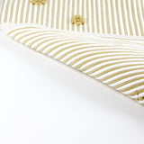 reverse of A yellow accent rug with a daisies pattern on it