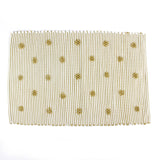 A yellow accent rug with a daisies pattern on it