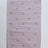 A madcap cottage pink accent rug with small daisy motifs across the front. 