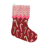 Red Christmas stocking with candy cane pattern on a white background