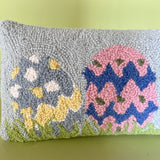 detail view of a Purple easter pillow with four easter eggs.