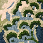 a close up of a blue and green rug with chinoiserie boatmen and pagoda motifs from madcap cottage.