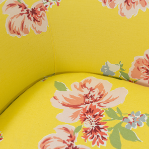 a yellow vintage floral loveseat