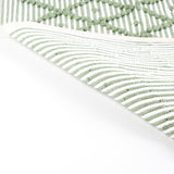 reverse side of A green accent rug with a diamond pattern on it