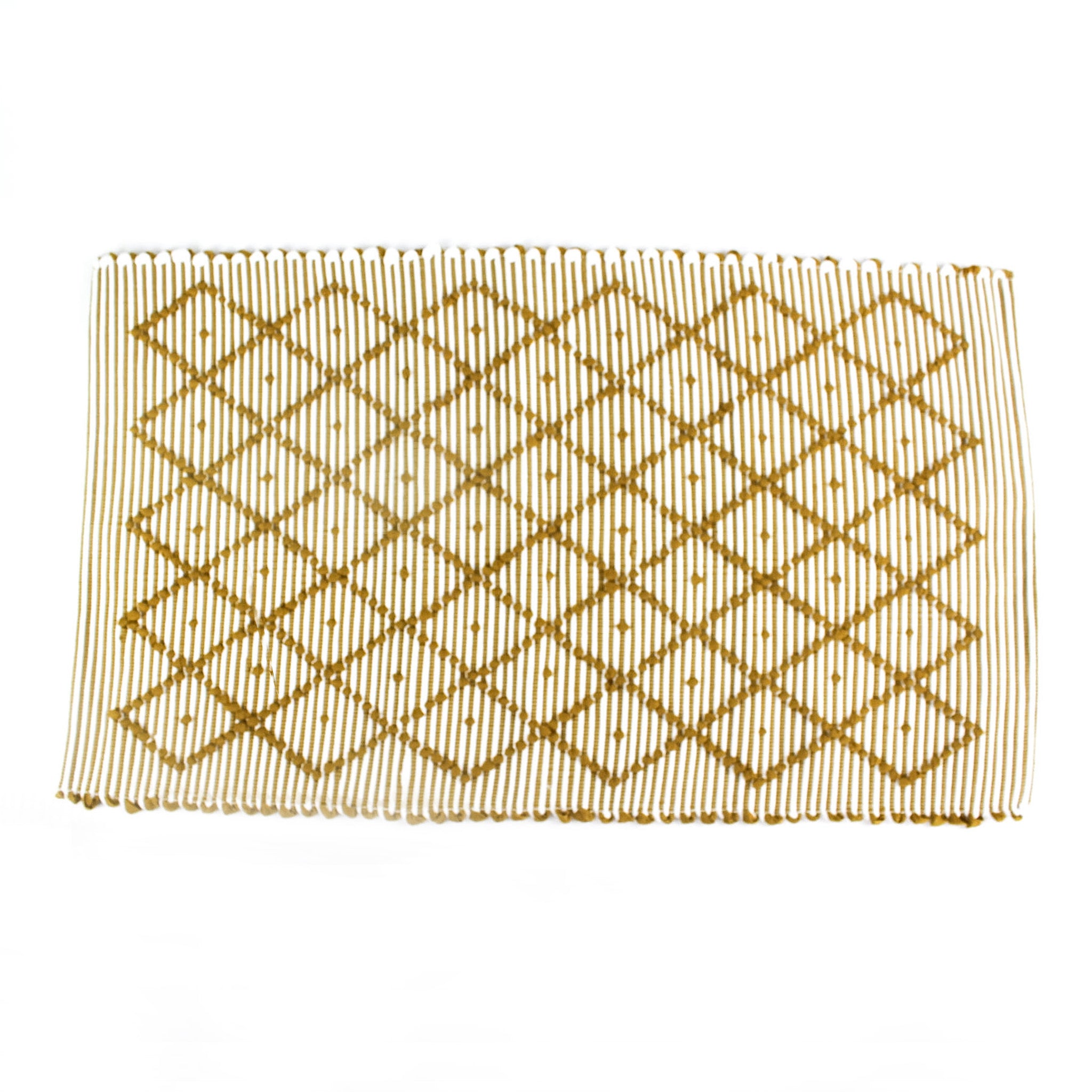 A yellow accent rug with a diamond pattern on it