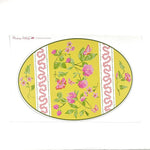 a packet of yellow floral paper placemats in the shape of an easter egg with text that reads Madcap Cottage 12 paper placemats in the top left corner.