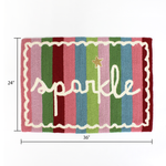 dimension of A striped rectantgular Christmas rug that says "sparkle" and has a white scalloped motif at the border