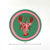 dimension of a round green and pink rug with a central red and pink lobster motif.