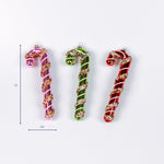 Set of three glass candy cane Christmas ornaments in pink green and red shown with 5 inch height and 2.5 inch width.