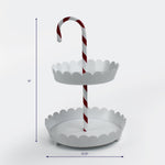 White two tier tray with scalloped edges and a candy cane striped handle shown with 18 inch height and 12.25 inch width.