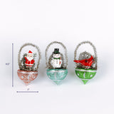 Set of three vintage style Christmas ornaments with Santa snowman and cardinal scenes shown with about 4.5 inch height and 2 inch width.