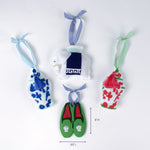 Set of four colorful felt ornaments including jars, slippers, and an elephant shown with one measuring about 5 inches high and 3.5 inches long.