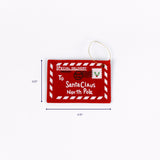 Red felt ornament shaped like a letter addressed to Santa Claus shown with 4.75 inch width and 3.25 inch height.