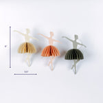 Set of three paper ballerina ornaments with folded skirts, 8 inches tall.