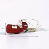Red glitter champagne bottle ornament with Santa figure clinging to it shown with 6 inch length and 2.25 inch height.