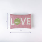 Pink rectangular pillow with the word LOVE and a green tennis ball design shown with 12 inch width and 8 inch height.