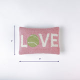 Pink rectangular pillow with the word LOVE and a green tennis ball design shown with 12 inch width and 8 inch height.