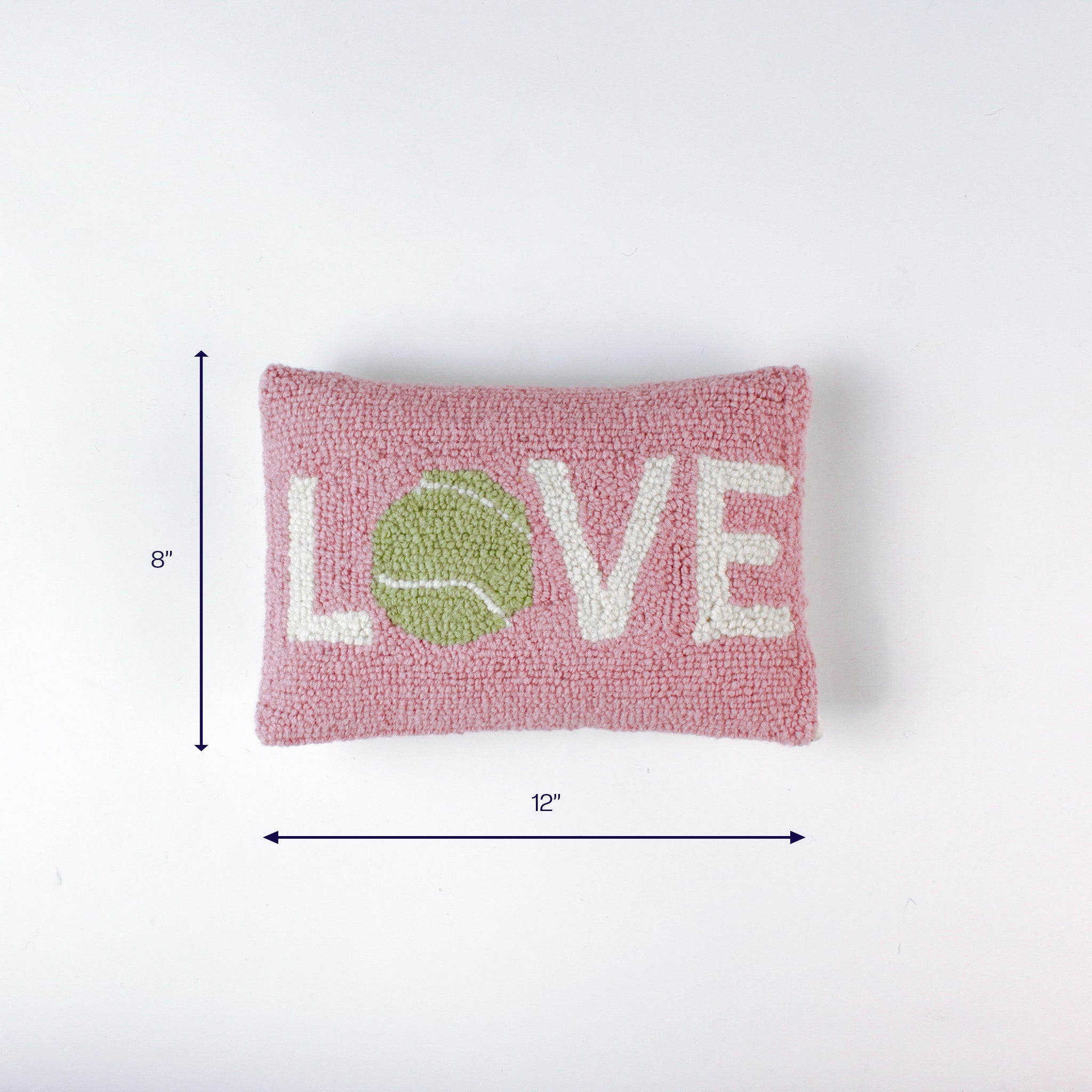 Pink rectangular pillow with the word LOVE and a green tennis ball design shown with 12 inch width and 8 inch height.