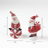 Two Santa figurines, one sitting on a peppermint ball and the other holding a sack of gifts, measuring about 6 inches and 5 inches tall.