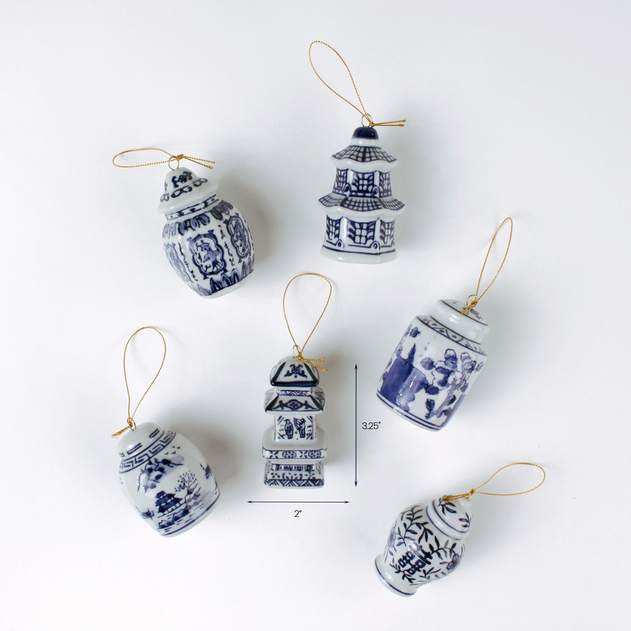 Set of six blue and white chinoiserie Christmas ornaments in jar and pagoda shapes shown with one measuring about 3.25 inches tall and 2 inches wide.