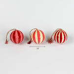 Three red striped spherical Christmas ornaments with gold hanging cords and tassels, each about 3.5 inches wide.
