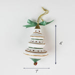 White and green tiered Christmas ornament with ribbon, measuring 4 inches high and 7 inches wide.