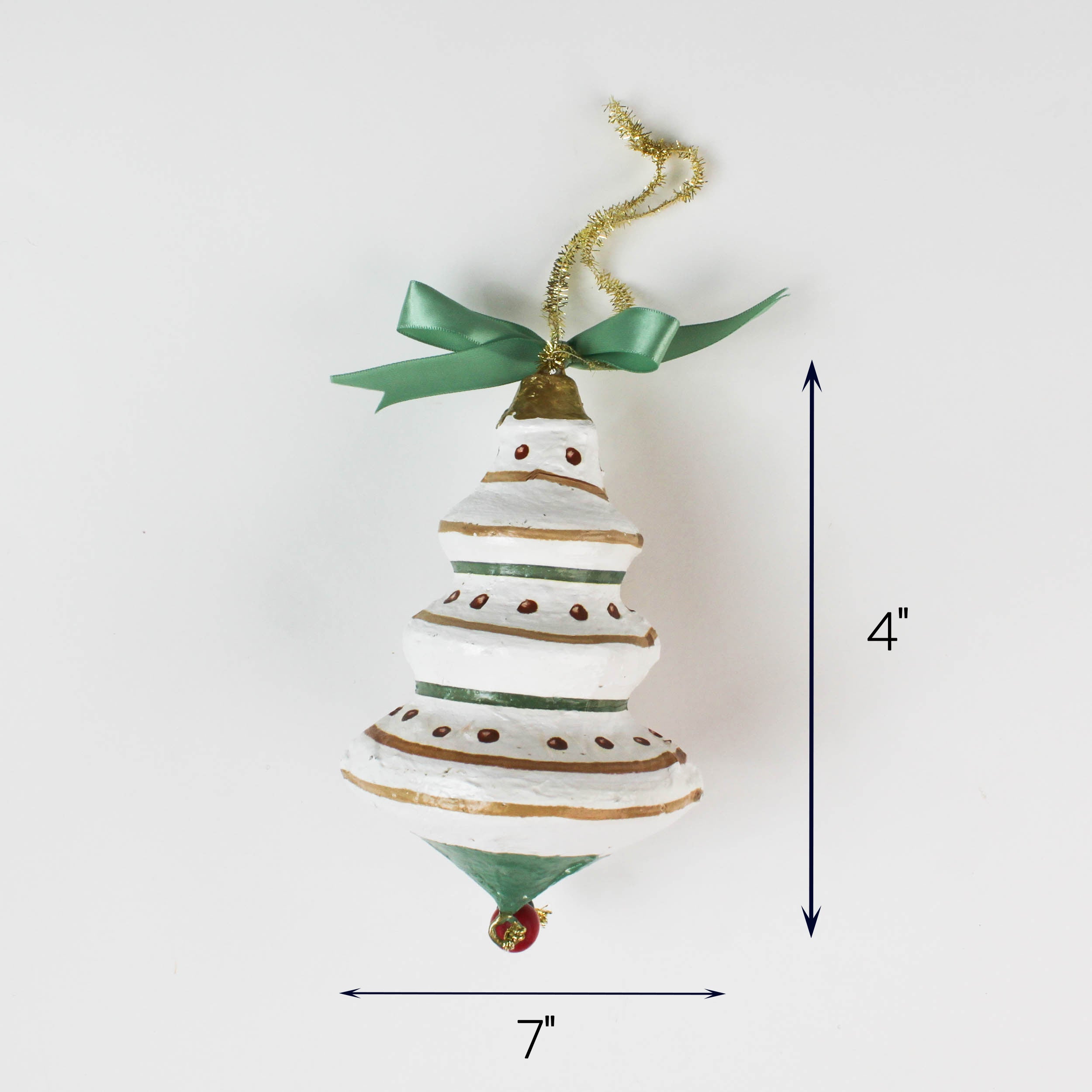 White and green tiered Christmas ornament with ribbon, measuring 4 inches high and 7 inches wide.