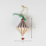 White and gold diamond-shaped ornament with ribbon, 4 inches tall.