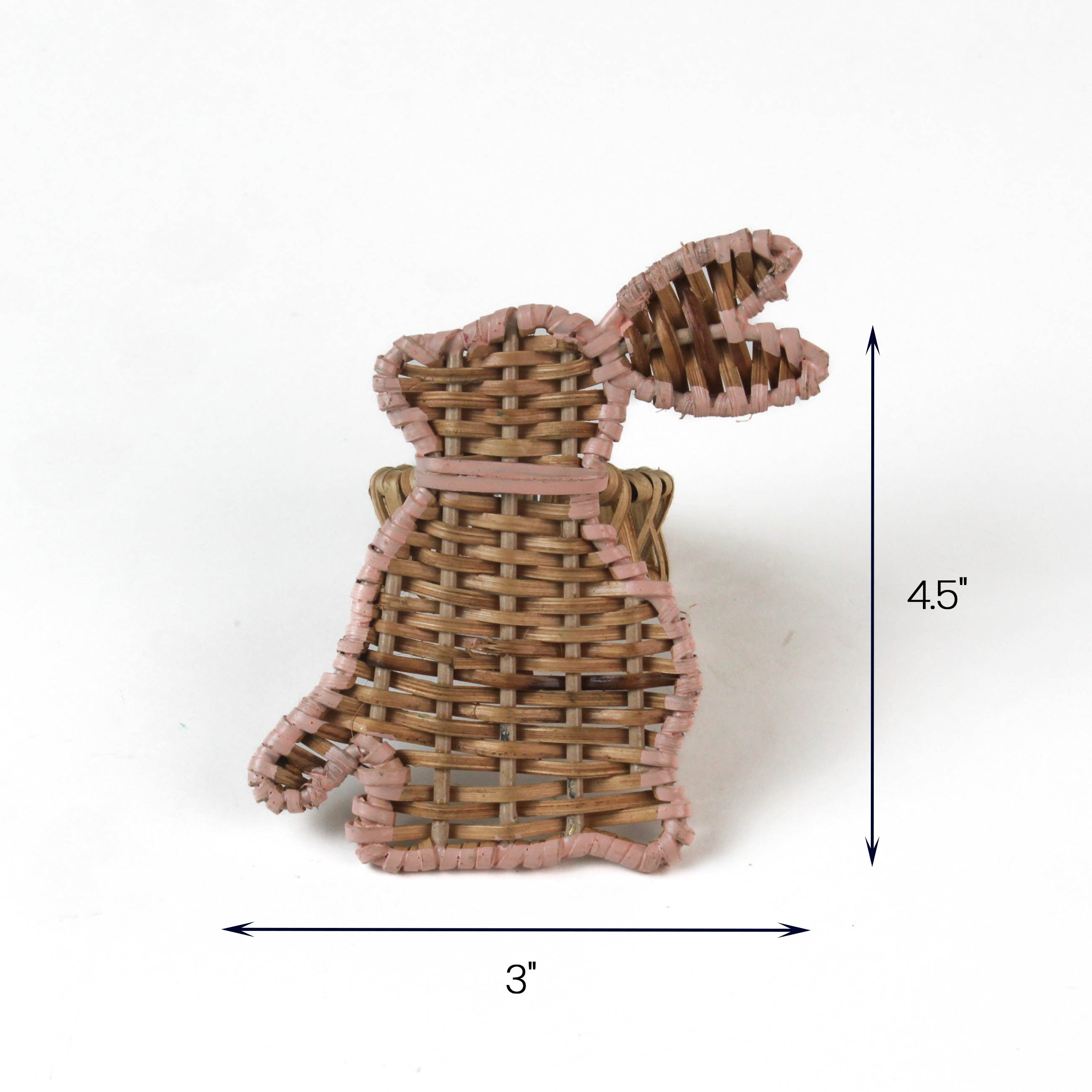 Woven rattan bunny-shaped napkin ring with pink trim, measuring approximately 4.5 inches tall and 3 inches wide.