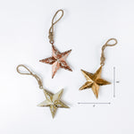 metal star Christmas ornaments in rustic gold copper and cream tones
