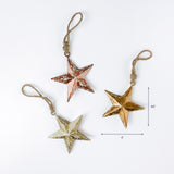 metal star Christmas ornaments in rustic gold copper and cream tones