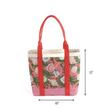 Large pink and green canvas tote bag with seashell pattern, coral-red handles, and reinforced base, measuring 18 inches wide by 12 inches tall