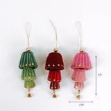 Set of three felt bell ornaments in green, red, and pink with gold sequins and hanging loops, measuring about 5.5 inches tall and 2.75 inches wide.