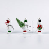 Three small snowman ornaments standing in a row, each with different hats and decorations, with measurement arrows showing their height of 3.5 inches and the center ornament width of 2.75 inches.