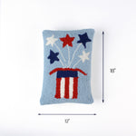 Light blue rectangular pillow with red, white, and blue starburst design and an American flag–themed base, measuring 18 inches high and 12 inches long.