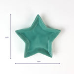 Teal star-shaped ceramic dish, 5.875 inches wide.