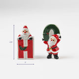 Two ceramic Santa figurines forming the letters H and O, approx. 3.75 inches tall and 2 inches wide.