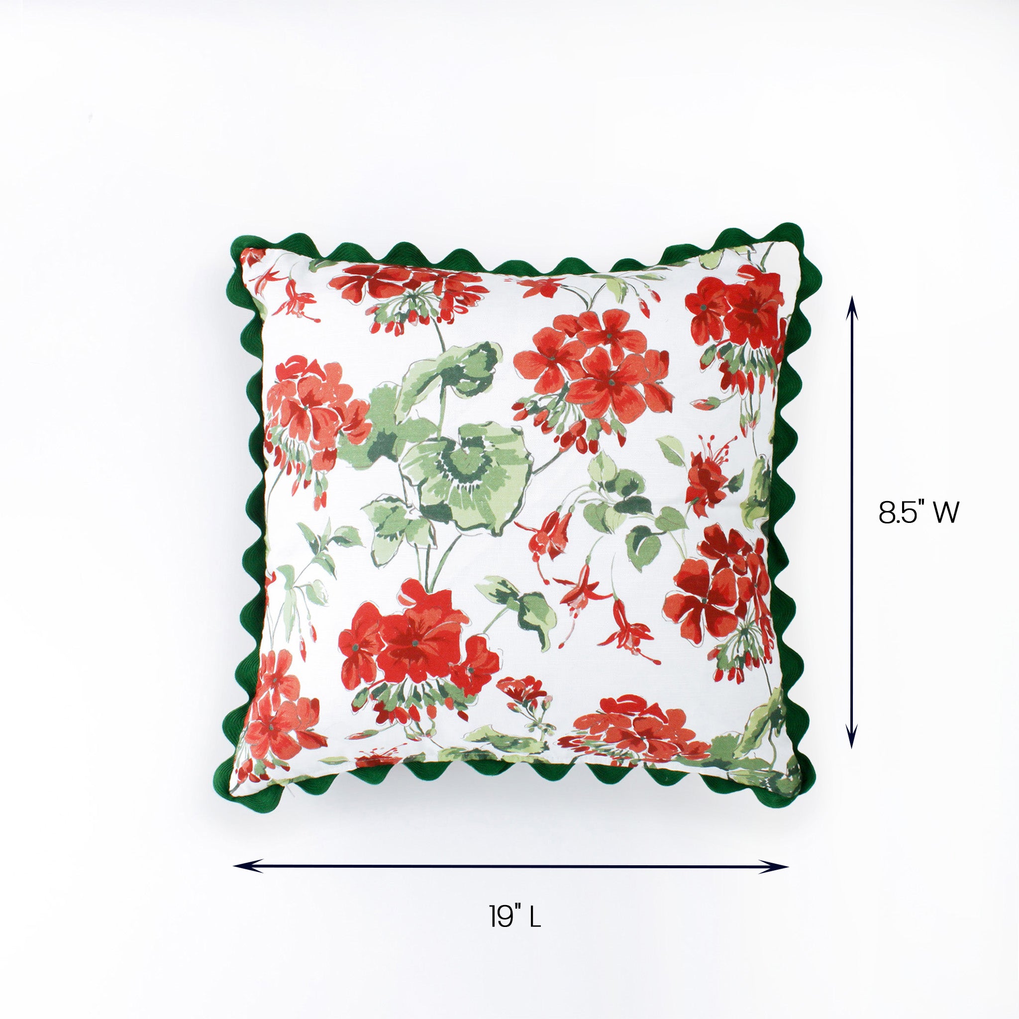 Square pillow with red and green floral pattern and scalloped green edges shown with 19 inch length and 8.5 inch width.