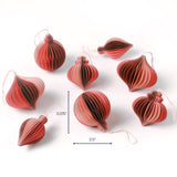 Set of red paper honeycomb Christmas ornaments in assorted shapes shown with one ornament measuring about 3.375 inches tall and 2.5 inches wide.