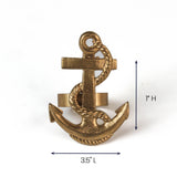 Gold anchor-shaped ornament, 3.5 inches long and 1 inch tall.