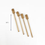 Set of four gold pineapple drink stirrers, 8.5 inches long.