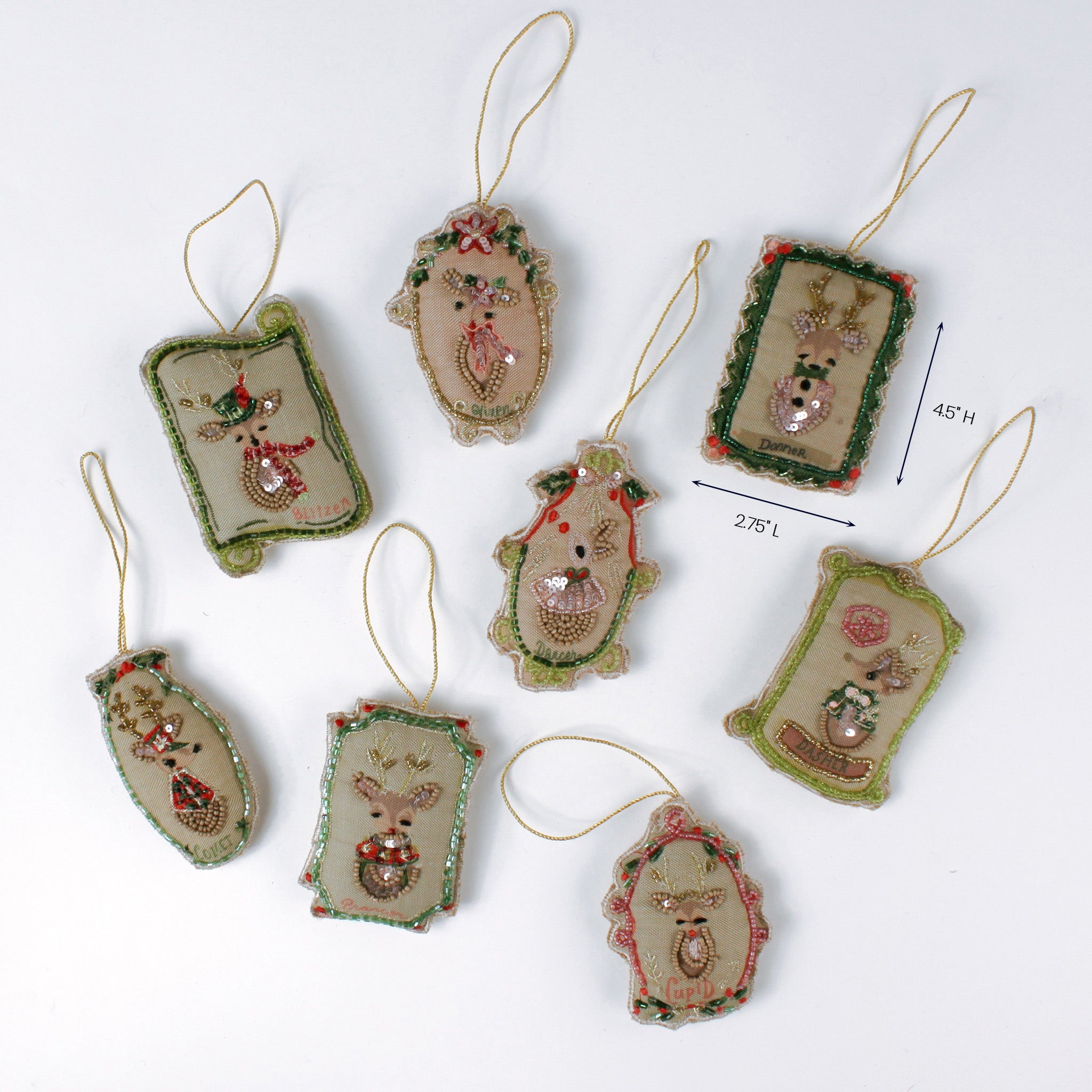 Set of embroidered reindeer Christmas ornaments in assorted shapes shown with one ornament measuring about 4.5 inches tall and 2.75 inches long.