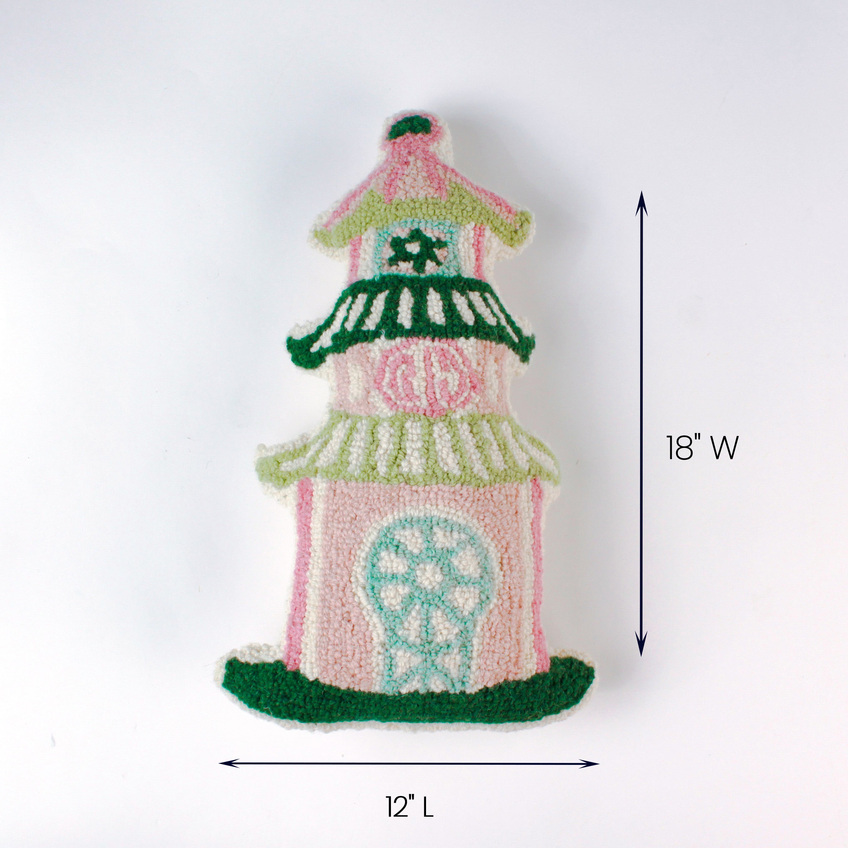 Pink and green pagoda-shaped decorative pillow shown with 12 inch length and 18 inch width.