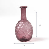 Purple textured glass vase with narrow neck, 6 inches tall and 3 inches wide.
