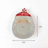 White ceramic Santa-shaped dish with a red-striped hat, shown with measurements of 7.125 inches wide and 11.25 inches tall.
