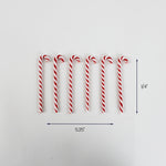Set of seven red and white striped candy cane ornaments arranged in a row, each measuring approximately 5.25 inches long and 0.25 inches wide.