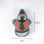 Snowman-shaped decorative pillow wearing a pink sweater and hat shown with 15.5 inch length and 5.25 inch height.